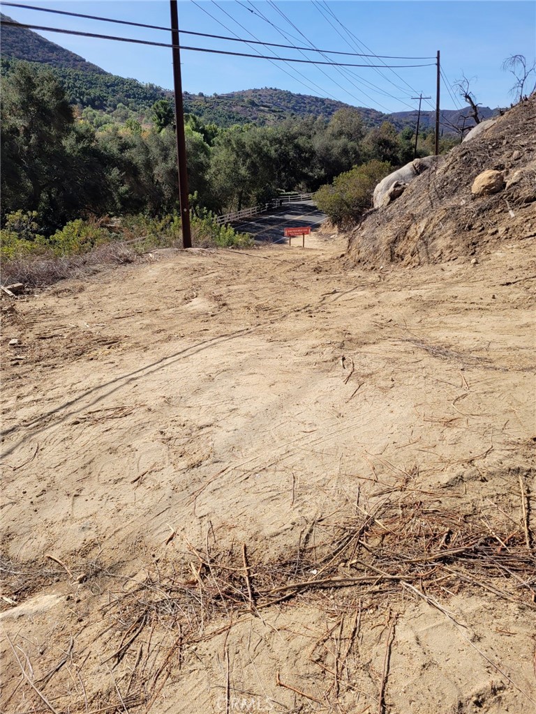 This land has zoning flexibility. Electricity lines directly in front of the property. Other utilities nearby. A flat pad on the top of the land with views. Envision the many possibilities when you view it!