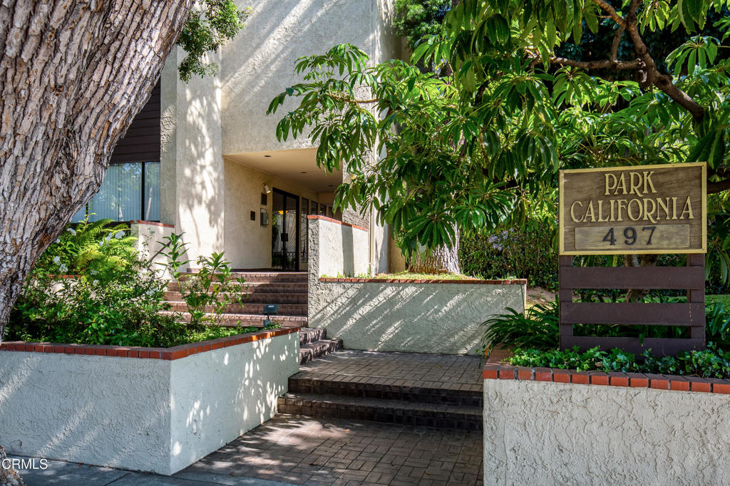 This spacious two-bedroom, two-bathroom condo is located in the heart of Pasadena and is set within a well- maintained complex that features a wonderful courtyard with lush landscaping and incredible amenities. Designed for comfort and style, the home has a great floorplan and features hardwood floors, high ceilings, crown molding, and plantation shutters throughout. The bright and spacious living room has a wet bar and a decorative fireplace. It opens to a large private patio that overlooks the courtyard, featuring a sparkling pool and mature gardens--the perfect space for relaxing or entertaining. The generous dining area sits just off the living room and connects seamlessly to the kitchen. The kitchen features abundant cabinet space, classic terracotta tile flooring, and recessed lighting. The primary suite has a large closet and a vanity area as well as an ensuite bathroom with a glass shower and separate tub. The second bedroom has sliding glass doors with plantation shutters and offers direct access to the patio. With a thoughtful layout, which includes an in-unit laundry room, this condo blends everyday conveniences with a resort-like atmosphere. This community also offers a private storage room, 2 side-by-side parking spaces in a subterranean parking garage, a pool, spa, fitness center and beautifully landscaped grounds. HOA dues cover landscaping, water, trash, exterior building insurance, an earthquake insurance policy and service for the pool, spa, security gates and fitness center. The condo is just minutes from shopping and dining in places like Old Town Pasadena, The Paseo Colorado, the Playhouse District and the South Lake shopping district. Don't miss the chance to enjoy the Pasadena lifestyle at its best. Welcome home!