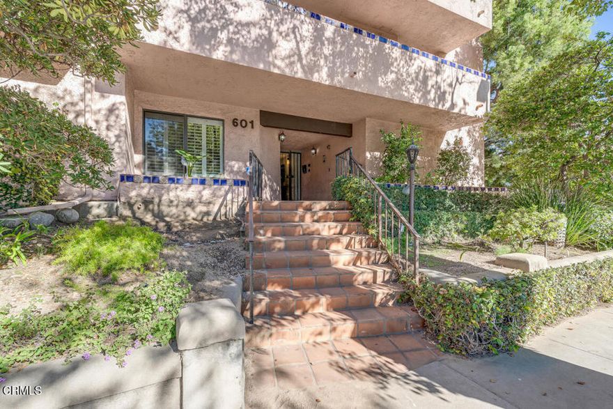 Looking for a safe, convenient, and low-maintenance home? This top-floor 2-bed, 2-bath condo in Pasadena's sought-after Madison Heights neighborhood offers comfort, privacy, and strong long-term value. Unit 306, located on the quiet third floor of a 34-unit building, features vaulted ceilings and a private deck with peaceful treetop views. The interior includes central A/C, a fireplace, an open living/dining area, and a warm, character-rich kitchen with natural wood cabinetry, deep blue tile countertops and backsplash, Saltillo-style flooring, and stainless steel appliances with a gas range. The primary suite offers an en-suite bath and generous closets, with both bathrooms updated with modern finishes. In-unit laundry and two gated parking spaces add everyday convenience. Close to Caltech, PCC, South Lake Avenue, Old Town Pasadena, and multiple grocery and coffee options, this location is ideal for students, commuters, or anyone seeking a walkable neighborhood. Whether you're securing a reliable home base or planning ahead for a future rental, this top-floor unit is a smart and low-maintenance choice in one of Pasadena's most desirable communities.