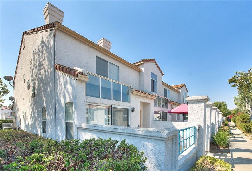Welcome home to this lovely 2 bedroom, 2 1/2 bathroom end unit condominium, located in the sought after gated community of Rancho Del Mar in beautiful Temecula.  The spacious living room features laminate flooring, a cozy fireplace and abundant natural light, with sliding glass doors leading to a private patio.  There is a separate space for a dining area, as well as a kitchen breakfast bar.  The kitchen also features granite countertops, a gas stove, refrigerator, dishwasher, ample cabinets for storage, and a convenient direct access door to the spacious two car attached garage.  A tastefully decorated half bath, closet/pantry, and an under the stair alcove complete the downstairs.  Both bedrooms are located upstairs, with the sizable primary bedroom featuring a large closet complete with organizers.  The ensuite bathroom is one of the two full baths located upstairs, as well as another bedroom and a separate laundry room..  This charming home is close to shopping, schools, parks, and Temecula wine country.  Must see to appreciate!