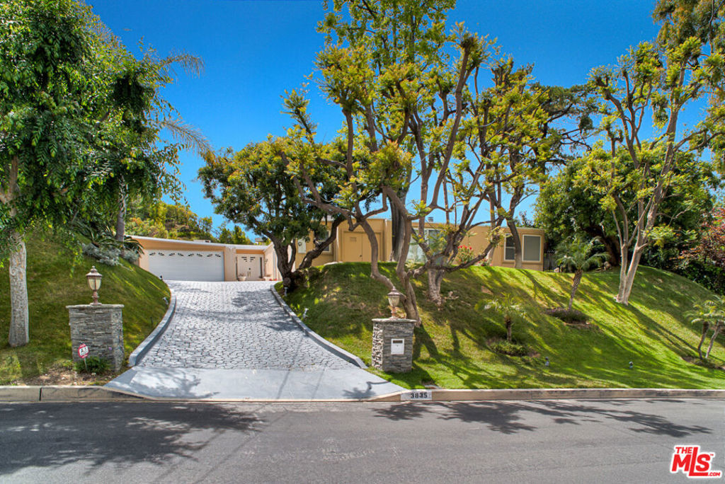 Nestled in prime Encino Hills south of Ventura Blvd in acclaimed Lanai Elementary sits this one-story traditional home. Drenched in natural light with open floor plan & vaulted ceilings, this 3,976 SF spacious home offers 5 bd+ 4 ba plus rec room. Front entry opens to formal living-dining room with lime stone tile & gas fireplace. The kitchen offers granite counter tops, white cabinets and stainless-steel appliances incl. Subzero refrigerator, 4 burner cooktop + barbeque grill, built-in double ovens, microwave & dishwasher. Master bedroom with fireplace & beautiful wood floors has sitting area & walk-in closet. In-suite master bath has walk-in shower. 3 additional bedrooms all with wood floors + 3 additional bathrooms. Rec room makes a great media room. Laundry in garage. The gorgeous backyard features a heated pool & spa, green grassy play area, lush hillside landscaping with cascading waterfall and large patio for entertaining. Please check out video. Property is 10 minutes to westside and just 8-10 minutes to Brentwood , close to 405 & 101 and wilshire corridor. Available August 1,2025