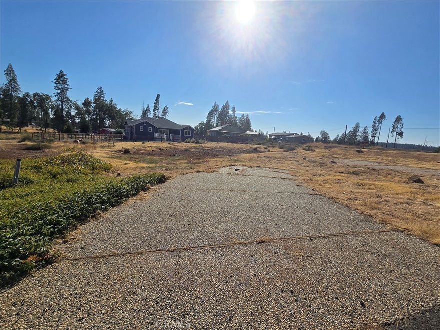 BEAUTIFUL property in a BEAUTIFUL location! This lot has been freshly cleared with the stumps already taken care of! Driveway still intact! Water and electricity located at the street! Septic condition unknown. This property previously held a 3-bedroom, 2-bathroom, 1,763 square foot home! Located in the Paradise Pines Properties Owners Association, you get access to a variety of amenities such as recreation rooms, playground, seasonal pool and hot, and even an exclusive bar! Need even more perks? No problem! The Magalia disc golf course is located just a short distance away! Come walk the property, view the neighborhood, and fall in love!