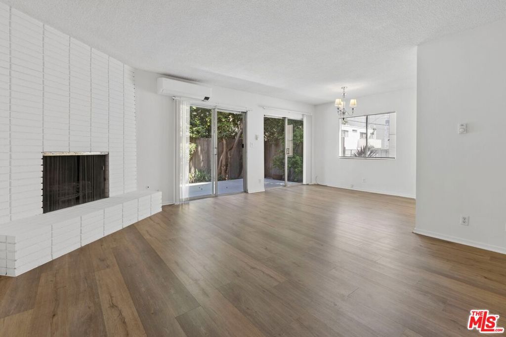 Beautifully updated 3-bedroom, 2.5-bath lower rear unit in a well-maintained Westwood property. This home offers approximately 1,727 sq. ft. of living space with an open floor plan, featuring a bright living room with a fireplace, newly painted interiors, and updated flooring. The kitchen is equipped with newer appliances, including a smart electric range, microwave, refrigerator, and dishwasher. Bedrooms are generously sized with mirrored closet doors, and bathrooms have been refreshed for modern comfort. Enjoy a private landscaped backyard with fruit trees, perfect for outdoor relaxation. Additional conveniences include central A/C plus wall units, on-site laundry, off-street parking, and utilities such as gas, trash, and gardener included in rent. Located minutes from UCLA, Santa Monica College, shops, dining, parks, and public transportation, this property combines comfort and convenience in one of West LA's most desirable neighborhoods.