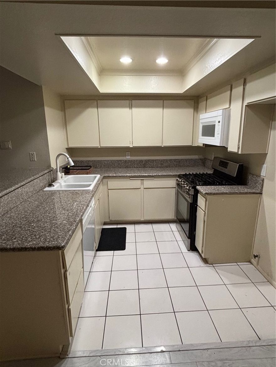 Terrific 2 story with open floorplan and spacious living area, great for entertaining. This unit features 2 primary suites, a 2 car attached garage, 11 x 9' private patio, washer & dryer, refrigerator and microwave. Located in a private area but close to shopping, HB High School, City Hall and not far from the beach.