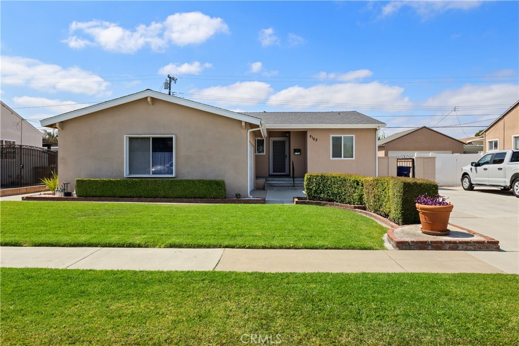 First time on the market in 63 years! This well-maintained three bed, two bath home has been lovingly cared for by the same family for over six decades. Located in the desirable Flower Tract, the home features a spacious living room that opens to the backyard and flows into the dining area. Bright galley kitchen with dinette and adjacent laundry room with side yard access. Nice-sized bedrooms, including a room with an ensuite bathroom. Original hardwood floors under the carpeted bedrooms, hallway and living room. Upgrades include central heating and air, dual-pane windows throughout, copper plumbing, plus a new roof!. Excellent curb appeal with a wide driveway and two-car garage. The backyard offers a large covered patio and two storage sheds. Great layout with solid bones—ready for your personal touch!