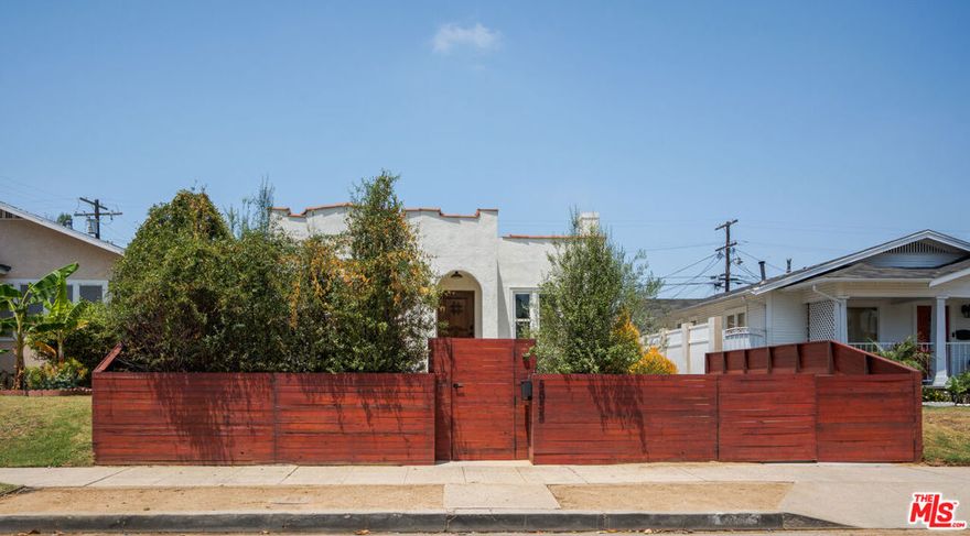 Timeless Charm Meets Modern Living in Hyde Park. Welcome to 5855 Madden Ave, a beautifully restored 1920s Spanish gem located in the heart of Hyde Park. This stunning residence effortlessly blends historic character with modern updates, offering a warm and stylish retreat in one of LA's most vibrant neighborhoods. Classic curb appeal greets you with a Spanish clay tile roof and arched doorway. Inside, laminate wood floors, and a decorative fireplace showcase the home's rich heritage, while abundant natural light fills every corner. The spacious formal dining room leads into a tastefully redesigned kitchen featuring custom cabinetry and stainless steel appliances. The home has been upgraded with new central HVAC, copper plumbing, electrical, and updated roof. Bedrooms are generously sized, and the updated bathrooms offer contemporary finishes with vintage flair. Out back, a detached ADU adds incredible versatility ideal for guests, a home office, creative studio, or rental income potential. The private backyard offers room to relax, entertain, or garden in peace. A gated driveway provides both security and convenience. Set on a quiet street just minutes from the West Adams arts district, Leimert Park, and the Crenshaw Metro line. 5855 Madden Avenue is a rare opportunity to own a thoughtfully restored piece of LA history with all the space and flexibility to grow into the future.