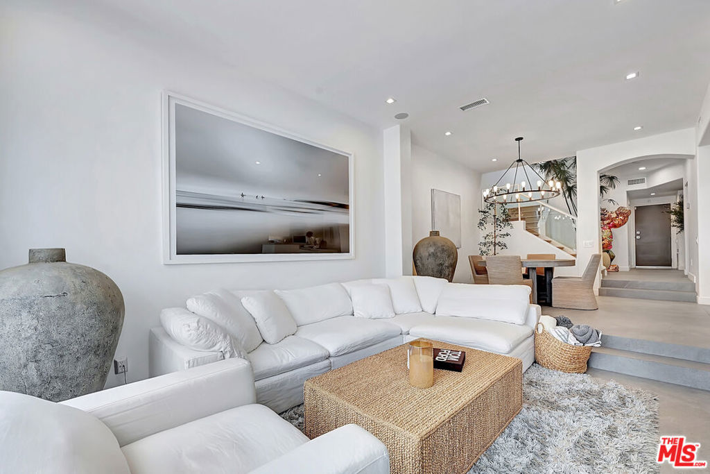 Beautiful ocean views welcome you home in this completely remodeled townhome in the exclusive Vista Pacifica above Broad Beach. Thoughtfully reimagined for the discerning buyer with an eye for detail, this home features soaring vaulted ceilings, and a bright, open floor plan that exudes space and sophistication. Enjoy elegant ceramic tile flooring throughout, a cozy fireplace in the living room and dual ocean-view decks on both levels that invite you to relax and unwind. The expansive primary suite boasts a marvelous walk-in closet and a spa-inspired bath with an enormous shower. The second and third bedroom are equally well-appointed and share a near by full bathroom with tub and shower. Additional upgrades include a state-of-the-art solar system with backup battery, an electric vehicle charger, and smart modern finishes throughout. Located in a secure, gated community offering a pool, fitness center, and proximity to acclaimed beaches, dining, and markets, this is Malibu living at its finest.