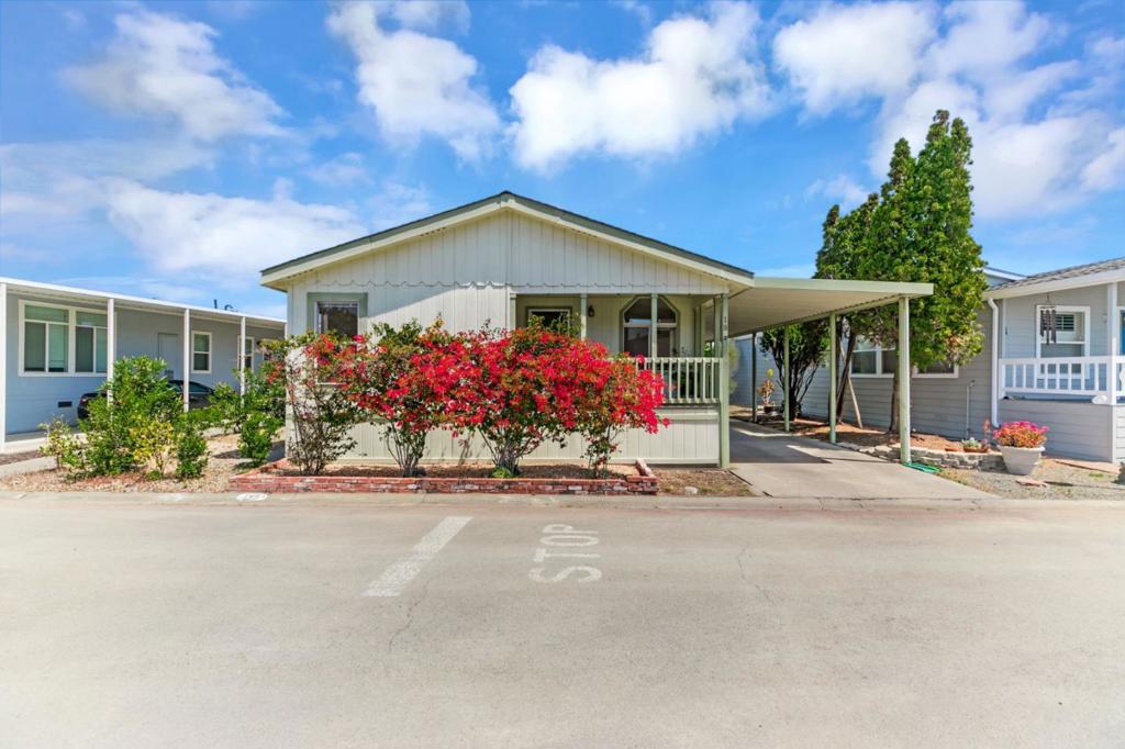 This meticulously maintained manufactured home offers 3 spacious bedrooms & 2 bathrooms in a desirable split floor plan that offers both privacy and functionality. Step into a bright and inviting living room & separate family room, perfect for entertaining or relaxing with loved ones. The renovated kitchen is a showstopper, featuring a large skylight, quartz countertops, stainless steel appliances, tile backsplash, and recessed lighting, all blending modern convenience with timeless elegance. Both bathrooms have been thoughtfully upgraded with stylish finishes, including quartz surrounds, dual sinks, a spacious shower, and a large sunken tub your personal retreat after a long day. This home has been lovingly cared for and thoughtfully updated: 30-year roof (installed in 2018), Brand new water heater (2025), Kitchen updates & bathroom update, llaminate flooring throughout, composite decking on porch & rear steps. Enjoy peace of mind, low-maintenance lifestyle in a community that puts everything at your fingertips. With easy access to Hwy 101, 237 & 85, commuting to San Jose, Milpitas, Fremont, Mountain View, Santa Clara, or Palo Alto is a breeze. Don't miss this rare opportunity to own a stylish, move-in ready home in one of Sunnyvales premier manufactured housing communities!