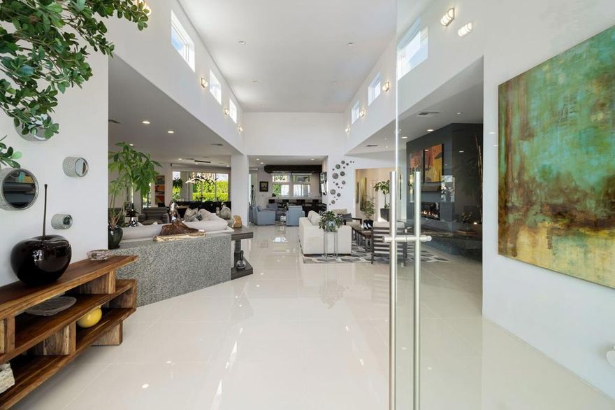 A truly spectacular luxury residence in the exclusive guard-gated community of La Residence. This fully remodeled 5,620 sq ft contemporary masterpiece combines impeccable design with sweeping mountain views. The gourmet kitchen is equipped with Wolf and Sub-Zero appliances, Executive Line cabinetry, dual dishwashers, quartz waterfall counters, and an oversized island with prep sink. Fleetwood sliding glass walls create seamless indoor/outdoor living, opening to multiple covered terraces, pool, spa, outdoor shower, and beautifully landscaped grounds. The primary suite offers a grand fireplace, dual baths, expansive custom closets, and picturesque outlooks. Additional highlights include skylights throughout, central vacuum, surround sound, outdoor heaters, motorized shades, solar system. A private casita with its own patio and pool access completes this resort-style property. Four-car garage plus ample parking. One of Rancho Mirage's most coveted addresses.