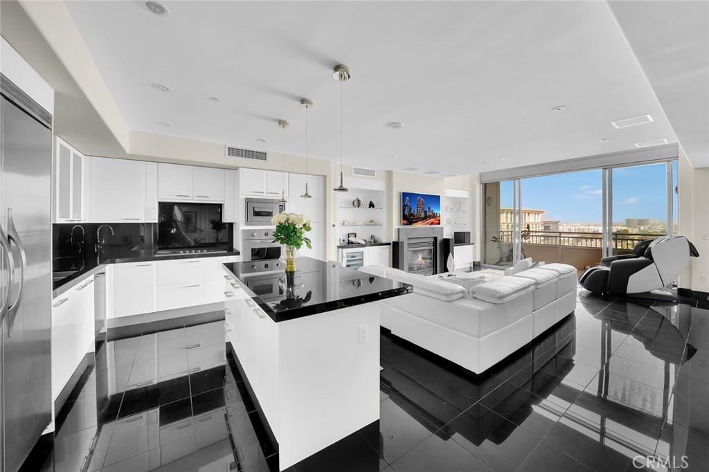 This stunning fully furnished Plaza-Irvine Penthouse is a breathtaking property that perfectly blends luxury and comfort. As you enter, you're greeted by a wide-open floor plan that seamlessly integrates living, dining, and kitchen areas, all bathed in natural light from the expansive large floor-to-ceiling windows and offers panoramic views. This exquisite Penthouse features two lavish suites, each designed with the utmost attention to detail, equipped with luxury finishes and offers a spa-like experience. The second level boasts panoramic views of the city and mountains, a spacious office or den, ideal for work or relaxation and adds an extra layer of versitility to this already impressive home. The chef's kitchen is a culinary dream, featuring a magnificent center island, Viking appliances, elegant stone countertops, and modern cabinetry that combines functionality with style. It's perfect for both everyday cooking and entertaining guests. The kitchen is sure to inspire your culinary adventures. One of the standout features of this Penthouse is the 24-hour concierge service, offering convenience and peace of mind. Whether you need assistance with package deliveries, or general inquiries, the dedicated concierge staff is always there to provide exceptional service. The luxe amenities at Plaza include 24-hour concierge service seven days a week, two resort-style pools and spa, a state-of-the-art fitness center, billiards room, club room, catering kitchen, conference room and additional on-site retail, restaurants and services. Convenient to Fashion Island Newport Beach, UCI, John Wayne airport and beautiful Orange County beaches. This Plaza-Irvine property offers an unparalleled living experience with its breathtaking city and mountain views, 24-hour concierge service and luxurious amenities. Located in the premier Irvine Financial District, this Penthouse is just moments away from fine dining, world-class shopping, ideal for those seeking both luxury, accessibility and an elevated lifestyle. HOA includes, gas, water, trash, basic cable/internet.