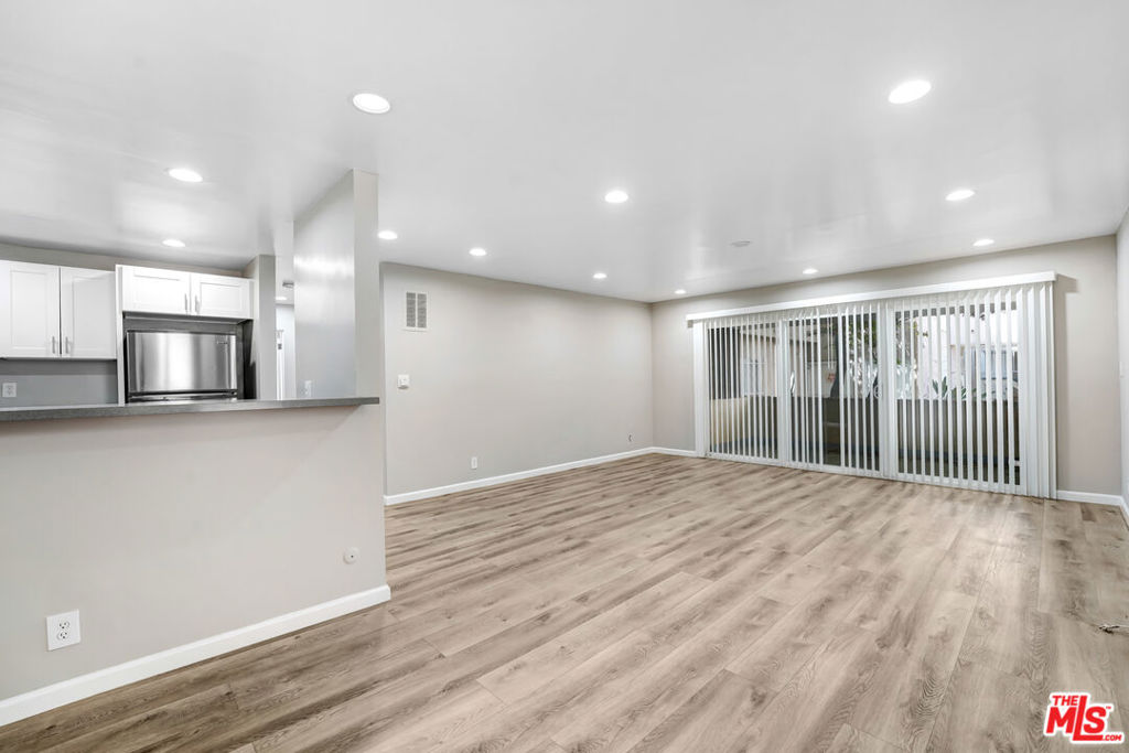 Welcome to this beautifully updated 2-bedroom, 2-bath residence nestled in one of Silver Lake's most sought-after pockets, just steps from Sunset Junction. The home features a bright open layout with wide-plank wood-style flooring, recessed lighting, and oversized sliding glass doors that lead to a private balcony. The modern kitchen is appointed with stainless steel appliances, sleek stone countertops, and ample cabinetry, perfect for both everyday cooking and entertaining. Spacious bedrooms offer generous closets, while both bathrooms showcase contemporary finishes with glass-enclosed showers, stylish vanities, and designer tile accents. Additional highlights include two parking spots, fresh paint, dual-pane windows, and thoughtful updates throughout. Situated in a prime walkable location, you're moments from cafes, boutiques, dining, and vibrant nightlife, making this the perfect blend of comfort, style, and unbeatable Silver Lake living.