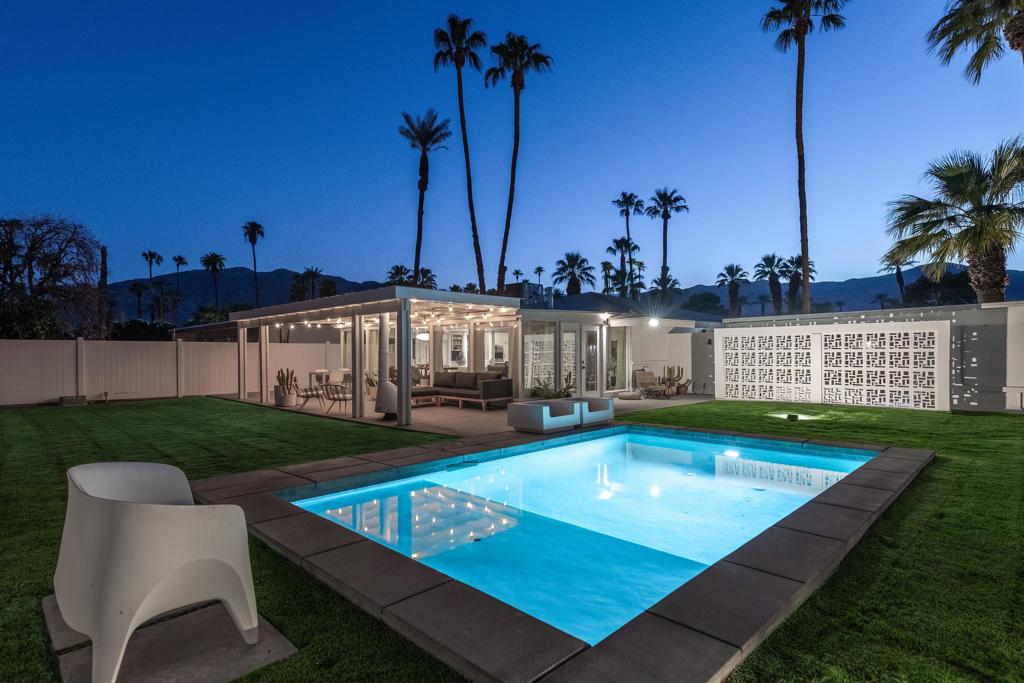 Nestled against the stunning backdrop of the Santa Rosa Mountains, this 1958 mid-century modern bungalow, designed by renowned architect Richard Leitch, AIA, is a masterful expression of desert modernism, where timeless design meets effortless sophistication.Distinguished by its iconic vaulted ceilings and refined, minimalist lines, this residence captures the essence of mid-century architecture while embracing the serene, sun-drenched lifestyle of the California desert. The interiors are a study in restrained elegance: a double-sided fireplace anchors the expansive great room and adjoining lounge, while two generously scaled bedrooms and two carefully appointed bathrooms offer comfort without compromising architectural purity. Walls of glass usher in natural light, amplifying the home's volume and forging a seamless dialogue between interior and exterior spaces.The outdoor environment is an entertainer's dream. A shimmering pool invites leisurely afternoons, while a vintage Malm fireplace beneath a shaded patio creates a striking focal point for evening gatherings. Whether hosting guests or savoring quiet sunset moments, the outdoor space is both visually captivating and supremely livable. With private outdoor space and mountain views, the property provides a perfect blend of relaxation and inspiration.A detached, thoughtfully designed office provides a secluded retreat for creative endeavors or remote work, blending utility with style in perfect measure. Located just around the corner from ''The River,'' a vibrant lifestyle center with shopping and a movie theater, the property offers convenience that complements its serene setting. Plus, it's just minutes from the upscale shopping and fine dining of El Paseo, offering a rare combination of privacy, elegance, and convenience.This architectural gem is more than a home, it is a living piece of design history. An extraordinary opportunity for the discerning collector of architecture and those who value design, authenticity, and the enduring charm of desert living.
