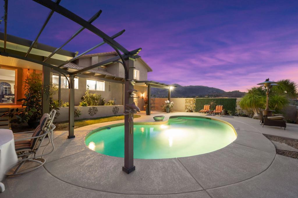 Can you imagine waking up to this view every day? Experience the beauty, serenity and tranquility of Cahuilla Hills in South Palm Desert...rural in feeling, yet just minutes from El Paseo's upscale stores and restaurants, Whole Foods Market, Trader Joes and more! Nestled against the Santa Rosa mountains, property overlooks city lights on 1.11 acres. Surrounded by nature, this amazing private sanctuary is designed to take full advantage of breathtaking views. Open floor plan, split-level home, 1,960 sqft, with 3-bedrooms and 2.5-bath. Custom renovated kitchen features an oversized island & decorative backsplash. Adjacent den (with fireplace) leads to sliding door that invites a lush-feeling, private, fully enclosed backyard. Landscape captures your senses to showcase mountain views while providing the ultimate in entertaining & relaxation areas. Alumawood patio covers provide shade & overlooks inviting Pebble Tec pool. Sweeping deck area perfect for lounging, bird watching & star gazing! Air conditioned 2-car garage. New 10X10 storage shed (also with air conditioning) and a window is privately situated--ideal for a craft studio. Enjoy fragrance from 2 kinds of orange & lemon trees. Property has been updated sensibly by attentive owner. Cahuilla Hills is uniquely situated in the foothills amid multiple hiking trails, between Stone Eagle & Big Horn Golf club. Looking for an enchanting setting featuring true privacy & endless views? You have found it! Call for an appointment to view this exceptional property *chandelier in primary bedroom excluded.