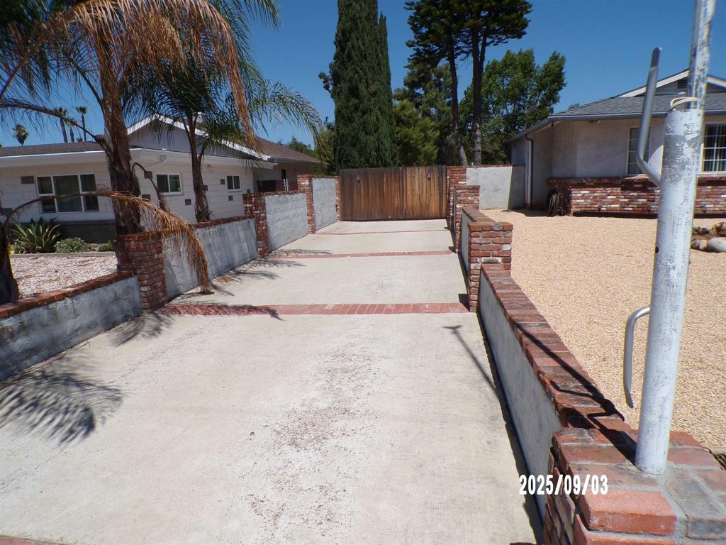 Spacious 4 bedroom, 3 full bath house on large lot, located a short .5 mile walk from Old Poway Park and Farmers market in desirable Poway school district. Almost 3/4 acre -completely flat and fully usable leaving opportunity for future growth or development as an investment property. Ample room for parking or RV's. Three separate storage units and the large two story garage/barn is permitted with an existing studio with full bath. New roofs installed in 2022 on both the house and the barn. Skylights in the bathroom and living room brighten the house. The primary has a spectacular walk-in shower with two shower heads and a central rain head. One of the other bedrooms also features an ensuite bathroom. All bedrooms have nice spacious closets with shelving systems. Come see the possibilities!!