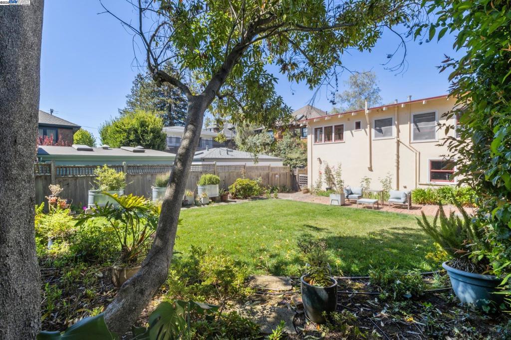 An incredible opportunity to own in Berkeley’s coveted Elmwood district, just steps from College Avenue and the world-class dining, shopping, and cultural amenities of the Elmwood and Claremont neighborhoods. This charming 1255 SQFT split-level home offers classic architectural details and a 2BD/1.5BA layout that invites creativity. The foyer opens to a light-filled dining room just off the kitchen. Up a half-flight of stairs, you’ll find two bedrooms and a full bath, while the spacious living room, rich with period character, provides a welcoming centerpiece for gatherings. The kitchen and bath await your inspired remodel, and the attached one-car garage sits at the end of a long driveway for ample parking. A large yard offers room for play, gardening, or potential development. The basement provides valuable storage or expansion potential, and an extra half bathroom. With both sewer lateral and BESO compliance already in place, you can dedicate your investment to the exciting transformations ahead. This is your chance to create something truly special in one of Berkeley’s most sought-after neighborhoods.