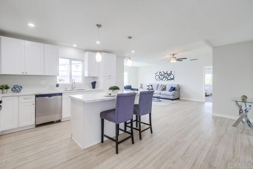 Beautifully remodeled two bedroom and two bath home in highly desired Palomar Estates East.   The kitchen has been exquisitely remodeled with a center island, shaker cabinets, quartz counter tops, stainless steel appliances, and a single basin stainless steel sink.  This home has new dual-pane vinyl windows allowing lots of light into the home making it light and bright.  Primary bedroom has large walk-in closet as well as an on-suite bathroom with a beautiful tile shower, tile floors, a dual vanity with white shaker cabinets and quartz counter tops.  New roof, air conditioner, and heater.  All the big ticket items have been take care of.  New plank vinyl flooring in the living spaces and carpet in the bedrooms.  Fan lights in living room, family room, primary suite, and guest bedroom.  The up and over stairs make accessing the carport door easy.  The shed will allow you to store all your extra items.  The home was re-leveled and replaced any bad pads and piers before the remodel.  Space rent is only $646.76.  Palomar Estates East is a 5 star 55+/35+ senior rent controlled park with many activities and amenities including a beautiful clubhouse, pool, spa, gym, putting green, pickleball courts, and tennis courts. This home is located minutes to Lake San Marcos dining and golf as well as local Carlsbad beaches, shopping, and restaurants.