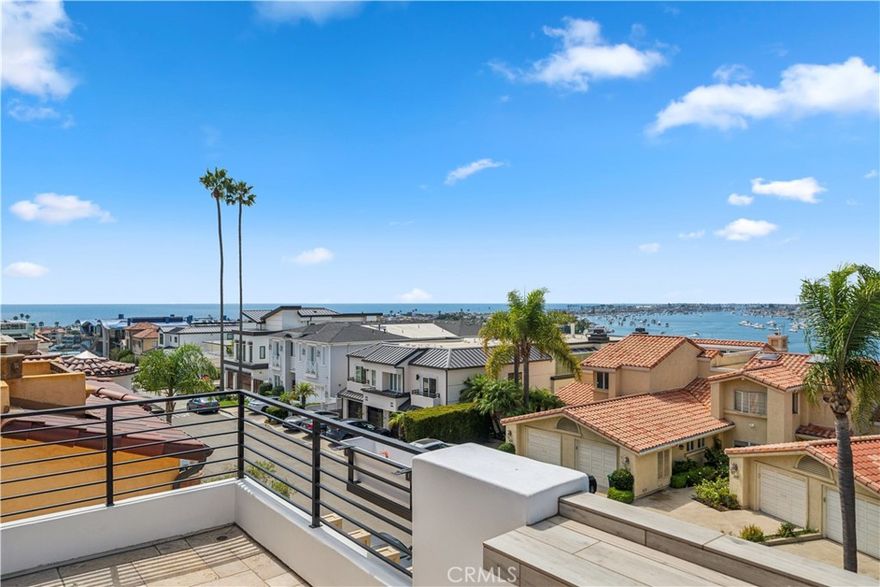 Just steps from China Cove Beach and moments from the world-class shopping and dining of Corona del Mar Village and Fashion Island, this private cul-de-sac residence has been completely renovated from top to bottom—blending modern luxury with timeless coastal charm. Perched high on a hilltop, the home is filled with natural light, ocean breezes, and framed by stunning views. The rooftop deck showcases infinite panoramas of the Pacific Ocean, Newport Harbor, sunsets, and the nearby Begonia Park. Inside, soaring ceilings, custom crown molding, and an open-concept floor plan highlight the meticulous attention to detail found throughout. The brand-new chef’s kitchen features Sub-Zero refrigeration, a Viking six-burner commercial-grade range with double ovens, a spacious island, custom cabinetry, wine storage, and a breakfast nook—designed for both entertaining and everyday living. Multiple living spaces are enhanced by stone fireplaces, designer finishes, and seamless transitions to the reimagined front patio with outdoor fireplace. The home offers four bedrooms (including two en-suites) plus a powder room. The fully renovated primary suite is a serene retreat with cathedral ceilings, fireplace, private balcony, spa-inspired bathroom, and a large walk-in closet. Completing this one-of-a-kind offering is a 3-car garage plus an additional reserved space, a rare luxury in this prime location. Available unfurnished or furnished at an increased monthly rate, this turnkey residence is an extraordinary opportunity to lease a refined coastal sanctuary in one of Southern California’s most desirable neighborhoods.