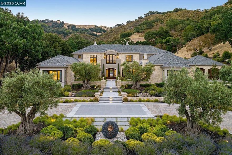 Happy Valley is the best neighborhood in Lafayette; Rose Lane is the best street in Happy Valley; and this is the best home on Rose Lane. Privacy and seclusion are the estate’s hallmarks. Fenced hillsides and mature oaks surround the home, offering unparalleled privacy. The home was custom-built in 2020 to the owner’s exacting specifications. Residents can leave the grounds and in minutes access Lafayette’s amenities and the best of the Bay Area. But, upon returning, the hustle and bustle are left behind, replaced by the estate’s serenity. The home features 5 bedrooms, all with en-suite baths; an exquisite kitchen; a massive refrigerated wine cellar; a living room under 20-foot ceilings; multiple dining, family and gathering areas; 2 laundry rooms; central vacuuming; and an elite security system. Two full-sized offices make work from home easy. Both inside and outside, the home provides venues for anyone’s recreation of choice: a swimming pool, putting green, elevated chipping tee; bocce court; sport court; multiple firepits; and a hillside water feature. The home inside offers still more spaces for play/entertainment: a golf simulator room, billiard table, card/games alcove, and fully equipped gym.