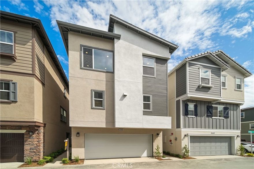 Discover modern living in this brand-new, three-story KB Home nestled within the gated Astaire at Starlite community in South El Monte. Spanning 2,088 square feet, this thoughtfully designed residence features 4 bedrooms and 3.5 bathrooms to suit a variety of lifestyles. The first floor includes a private bedroom with a full bath—perfect for guests, multigenerational living, or a quiet home office. On the second floor, enjoy an open-concept layout where the spacious great room flows into the dining area and stylish kitchen, complete with a large island and stainless steel appliances—ideal for gathering and entertaining. Upstairs, the primary suite has a walk-in closet and dual-sink vanity, while two additional bedrooms and a laundry area provide everyday convenience. Outside your door, enjoy resort-inspired amenities such as a pool and spa, recreation center, and scenic walking trails—all within a secure, gated neighborhood. Located close to schools, shopping, golf, and major freeways, this home offers the perfect blend of comfort, community, and commuter-friendly access.