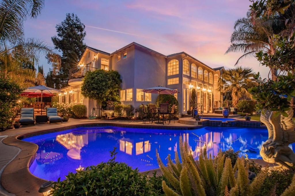 Luxury Living at Its Finest in Ridgemark Golf & Country Club overlooking the 13th hole. Step into sophistication with this grand executive-style home where elegance and function meet in perfect harmony. From the sweeping staircase to the marble floors, every inch of this home exudes refinement. *Light-Filled & Lavishly Appointed Soaring ceilings and oversized windows fill the home with sunshine, while French doors open up to your own backyard retreat complete with a sparkling pool, relaxing spa, and manicured patio ideal for hosting gatherings. Fireplaces add a cozy touch of ambiance, while custom built-ins and intricate finishes bring personality to every space. For the Culinary Enthusiast-A Professional Grade Kitchen built for performance and beauty with extensive cabinetry, high-end finishes, French door oven, Sub Zero, generous counter space, and two sinks for added convenience. Every detail is built with both form and function in mind. Retreat-Worthy Bedrooms-Every en suite is a private sanctuary, featuring spa-like baths, jetted showers. Extras That Make Life Easier: Dual-zone A/C & heating, Central vacuum, Tankless Water heater, 21k Solar System. This grand-scale home is truly one of a kind designed for entertaining, relaxing, and living exquisitely.
