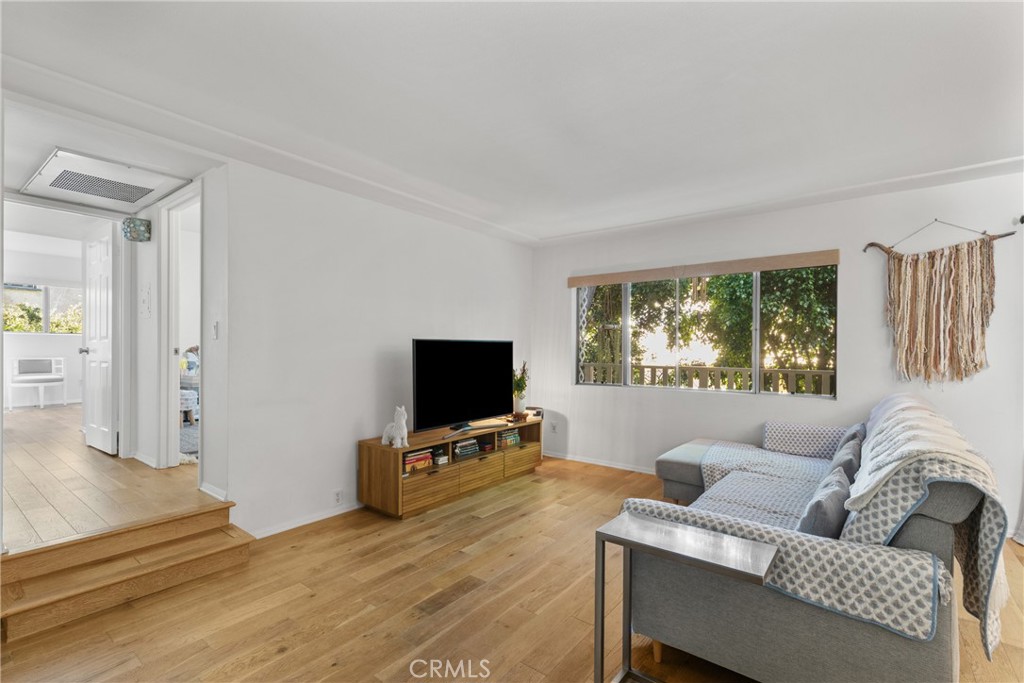 Welcome to this charming 2-bedroom, 2-bath end-unit condo tucked away in a quiet Cape Cod-style community in the heart of Sherman Oaks. As you step inside, you are greeted by hardwood-style floors and fresh custom roller window shades. The updated kitchen features modern white cabinetry, sleek quartz countertops, and a deep farmhouse-style sink. It opens beautifully to the dining area, where a large window offers views of lush greenery, creating a warm and stylish setting for everyday meals or entertaining guests. Both bathrooms have been updated with clean, modern finishes that complement the overall style of the home. Both bedrooms offer generous walk-in closets, and the unit features central air conditioning with a smart thermostat for personalized comfort. Thoughtfully updated and filled with natural light, this home is a peaceful retreat that still keeps you connected to the vibrant lifestyle of Sherman Oaks. Community amenities include a fitness room, recreation room, and conveniently located laundry just steps from the unit. Two tandem parking spaces are located in a secure garage with additional storage. Enjoy the unbeatable location just moments from Whole Foods, coffee shops, popular dining, Ventura Boulevard, and the 101 freeway. Whether you’re heading out for a canyon drive or walking to your favorite neighborhood spots, this home places you in the center of it all while still offering a serene and private setting. This is the lifestyle you’ve been waiting for. Don’t miss your opportunity to call this special property home.