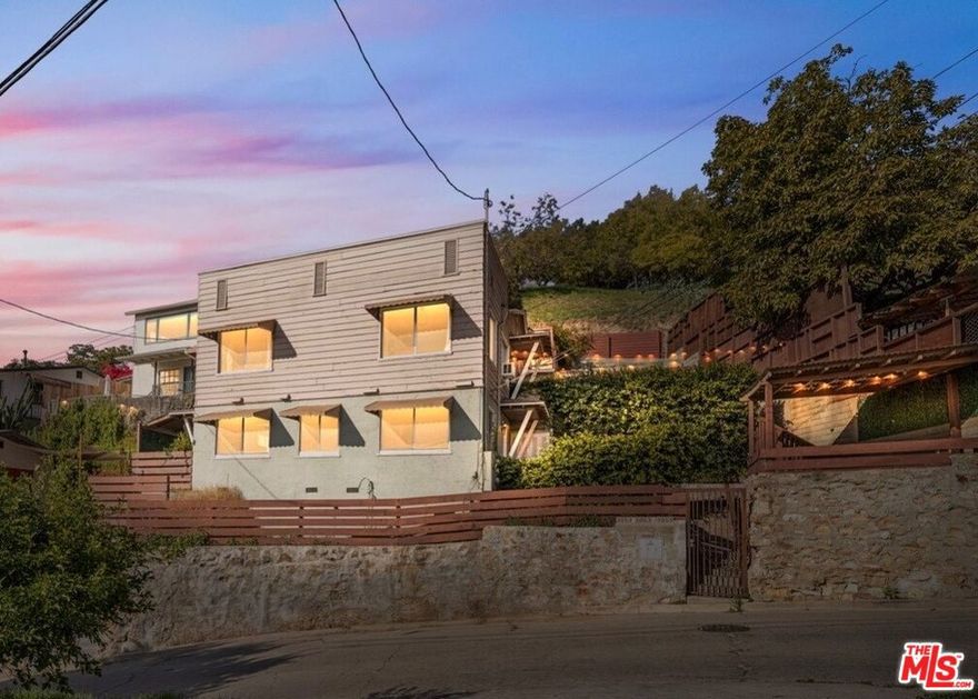 The perfect hillside Northeast LA "house hacking" opportunity - WITH VIEWS! 3 units for the price of a single-family home in the area! The vacant (1Br+1Ba) unit has incredible views from all large windows and has been completely remodeled inside. It feels spacious and features new LVP flooring and paint throughout, recessed lighting, new heat and AC, a new kitchen cabinets and bathroom, extensive storage in the bathroom, and it has an adorable dining area with a view right off the kitchen. It has two entrances and private patio. The remodel of the owner's unit includes stainless appliances, marble look / quartz countertops, tile and glass tile backsplash, and a workstation ledge kitchen sink. The bathroom has mosaic floor tile and complimentary mid - century modern style tile throughout the bathroom, as well as a new tub shower combo, floating vanity sink, and bathroom mirror with integrated LED lighting. The unit is ready to move in, just bring furniture! The property also includes two well-maintained (Studio+1Ba) apartments that are currently tenant-occupied and generating a total of $4,400 per month in income to help pay the mortgage. The property sits on a street-to-street lot in Mt. Washington, just a short distance to local favorites including Loquat Coffee, Barra Santos, 1802 Roasters, Cafe Antonietta, Taqueria Frontera, Dunsmoor, ROAM LA Yoga, and other beloved local staples. With quick and easy access to Division St, Cypress Ave and Figueroa, the property is near the LA River bike path, Rio de Los Angeles State Park & Rec Center, and more. Easy access to I-5, the 2, and 110s Freeways. This property is ideal for an owner-user but works great as an investment! Listed at under 13 GRM and a 5.7% CAP Rate!