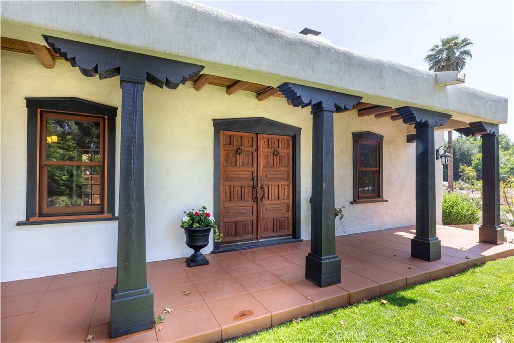 Charming 1928 Adobe Ranch with Equestrian Facilities on 3.7 Acres. Step into timeless California living with this beautifully restored 1928 adobe ranch home, nestled just three miles from downtown Redlands. Situated on 3.7 landscaped acres, this unique property blends historic character with modern upgrades and horse stables and arena. The main residence has been thoughtfully updated while preserving its classic adobe charm with beautiful hand hewn log beams from Big Bear almost 100 years ago, well preserved wood floors, four wood burning fire places, an updated kitchen about 10 years ago, fresh stucco, a new roof, and numerous interior upgrades throughout. The primary suite offers a large walk in closet, additional built in closets and large bathroom with separate dual sinks. Third bedroom in the main house was converted to the family room. The garage was recently renovated, and a large storage area has been added off the garage area. A beautiful rose garden welcomes you at the front of the home, adding to the property’s serene charm. Equestrian enthusiasts will appreciate the fully repainted horse barns, spacious stables, and a well-maintained riding arena—perfect for training or leisure riding. A separate, beautifully appointed casita offers a generous one bedroom layout with a separate large kitchen and 3/4 bathroom, ideal for guests, in-laws, or rental income. For golf lovers, this property is a true delight, featuring both chipping and putting areas on the grounds. This rare estate offers privacy, functionality, and style in one of Redlands’ most desirable locations. Don’t miss your chance to own a true piece of Southern California history.