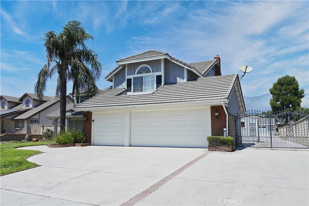2 House on a 19,600 sq ft lot! No HOA, No Mello-Roos. Ideal for multi-generational living or live one and rent one out. Exceptional multi-dwelling estate. 1,200 sq ft 2025 built Double entrance door ADU with 10 ft ceiling, 3 bedrooms, 2 bath, modern European cabinetry, panorama windows, pay-off Tesla solar panels, EV charger outlet and 2 car extra size garage. Whether used for rental income, in-laws, guests, or a home office, this space offers endless possibilities. Main house has 4 bedrooms and 3 baths and 2,579 square feet of living area, a cement tile roof and a 3-car garage. 1 bedroom and 1 bathroom downstairs. The entry opens to the formal living room and separate dining room with vaulted ceiling. The kitchen offers ample cabinet and counter space plus eat-in kitchen area. The family room is open to kitchen and features a cozy fireplace. There is a separate laundry room downstairs with upper storage cabinets. Upstairs you will find the primary bedroom with double closets and ensuite bath with separate tub and shower. The third and fourth bedrooms share a hall bath with double basins and tub-shower combination. There is patio sunroom on the rear of the house. Block walled rear yard features an in-ground pool and spa and lattice covered patio with brick accents. The lot is cross fenced with two storage sheds on site plus gated RV Parking! 2 houses have its own individual electrician meter and house number. Rare opportunity to own a truly multi-functional and luxurious compound in prime Rancho Cucamonga!
