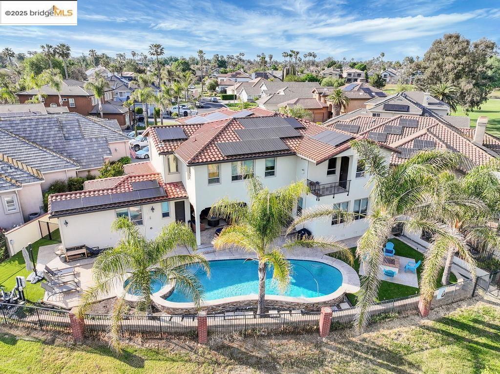 Seller is offering a rate BUYDOWN credit. The backyard is a showstopper! Featuring a sparkling pool with cascading water features, spa, firepit, and panoramic views of the golf course and tranquil water pond with no rear neighbors. Whether you’re entertaining, unwinding, or waking up to the sunrise every detail of this home is designed to elevate your lifestyle. You can even sit on your private primary bedroom balcony for morning coffee! Enjoy nearly 4,100 sq ft of living space in this custom Mediterranean home, where timeless design meets luxury. The front private courtyard welcomes you with cascading water feature, built-in lush greenery planter boxes, just add a touch of ambient bistro lighting giving you the perfect place for a quiet glass of wine or morning coffee as your drift away to a mental vacation. Inside, you’ll find a chef’s kitchen with rich wood custom cabinetry and a grand vent hood centerpiece all located within a gated community with access to over 1,000 miles of the Delta Waterways nearby. This one-of-a-kind home offers warmth, elegance, and privacy in one of Discovery Bay’s most desirable neighborhoods. Contact agent for details. Seller incentives subject to lender approval.