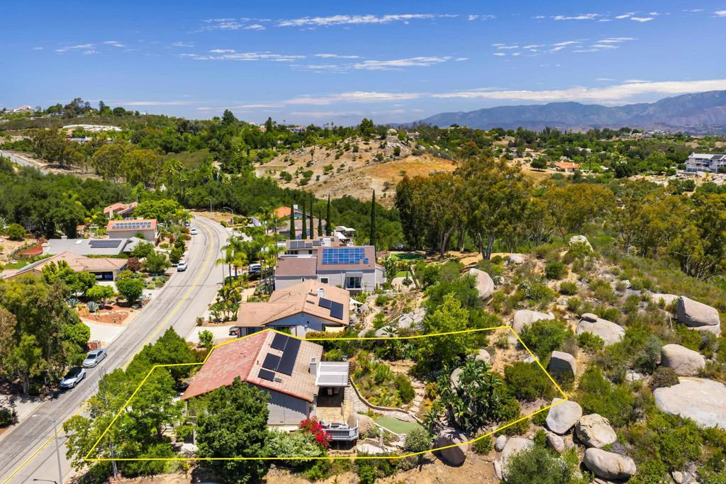 Nestled in the picturesque hills of Hidden Meadows, this beautifully updated 4-bedroom, 2-bath home blends comfort and elegance with stunning panoramic views! Designed for modern living, it features vaulted ceilings, an abundance of natural light, large secondary bedrooms and a spacious bonus room perfect for a game/media room or home office. The Primary Suite is a serene retreat, complete with a luxurious marble bath and a walk-in closet with custom organizer. The open-concept layout flows seamlessly to the outdoor space, where you’ll find a new covered pergola perfect for outdoor dining, panoramic mountain views, a custom putting green, and professionally landscaped grounds—creating the ultimate entertainer’s backyard. Additional highlights include OWNED house solar, a 3-car garage, and a peaceful setting surrounded by boulders and native landscape. Located in the highly desirable Hidden Meadows community, with a huge community pool, 2 tennis courts, nearby golf, hiking, market & restaurant, and easy freeway access—this is a rare opportunity to enjoy refined living in a truly scenic setting."