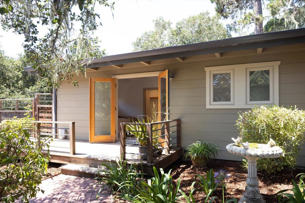 Located in the desirable South Carmel Hills, this single-level 2-bedroom, 2-bath main house plus separate studio offers comfort, privacy, and convenience. Built in 1959 on a 0.33-acre lot, the property provides 1,659 sq ft of living space with an easy floor plan designed for everyday living. The spacious living room features a gas log fireplace, bamboo flooring, and large windows that fill the home with natural light while framing views of the surrounding landscape. The kitchen includes counter seating plus a dining area that flows naturally into the main living spaces, and French doors that open up to a deck for outdoor garden seating, creating a welcoming setting for gatherings. The primary bedroom suite with walk-in closet overlooks the back garden and opens up to a large sunny deck. Additional highlights include a converted garage into additional living space, and a large lot with mature trees that enhance the sense of seclusion. Set within the Carmel Unified School District, the home is just minutes from downtown Carmel-by-the-Sea, offering convenient access to shops, dining, galleries, and Carmel Beach. Combining location, charm, and potential, this property presents a rare opportunity to own a well-cared-for home in one of Carmels most sought-after neighborhoods.