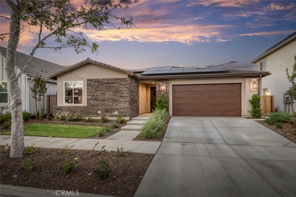 This 4bd, 2ba home offers 1,926sf on a 5,227sf lot with owned solar and extensive builder and custom upgrades. Located in McCaffrey's Savanna at Tesoro Viejo, Creekside Community, this single-story home offers views, quality, and a setting that's hard to find. Enjoy sweeping vistas of the Sierras and nearby Table Mountain mesas from the fully landscaped backyard with herringbone pavers, lawn, and dual seating areas. Inside, the open-concept layout includes a great room with built-in speakers and single-panel French doors from both the dining area and the primary suite, each providing access to the covered patio. The kitchen features quartz perimeter countertops and a striking black granite center island, complemented by shaker cabinetry, a full backsplash, pendant lighting, and an induction cooktop with hooded vent. The primary bath also includes a black granite countertop, along with dual sinks, a custom tiled shower with matte black accents, and a walk-in closet. The garage includes ceiling racks for bonus storage and a sealed floor. Creekside residents enjoy internet with their HOA, miles of trails, wildlife sightings, and a planned second clubhouse with gym and lagoon-style pool. All Tesoro Viejo residents also enjoy The Hub, Ranch House clubhouse, and access to the San Joaquin River, with the Rio Mesa Blvd extension planned for 2026.