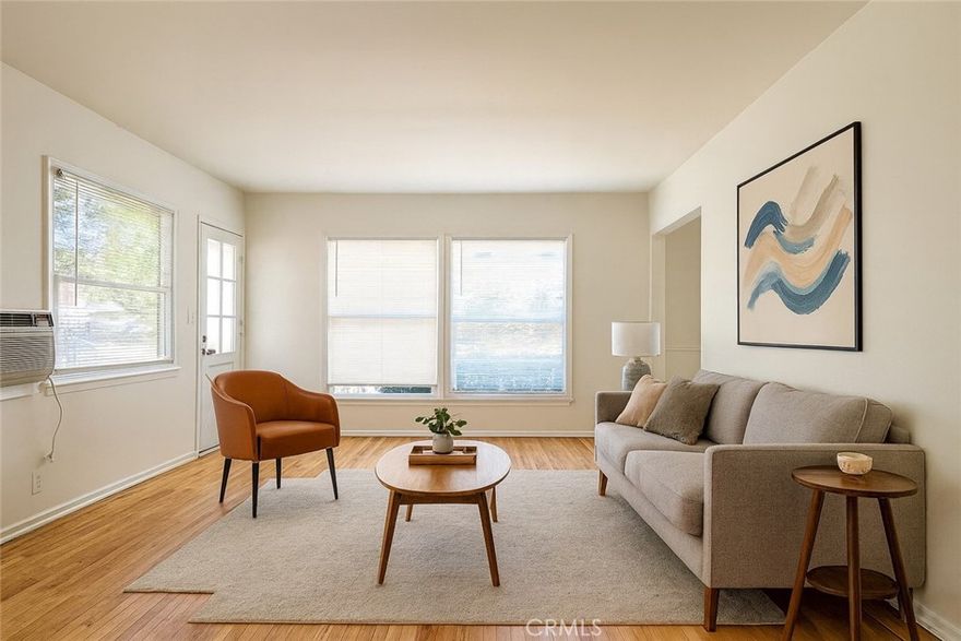Charming 2-Bedroom, 1-Bath Apartment for Rent with a 1-Car detached garage. This delightful apartment offers a blend of vintage charm and modern convenience. Featuring beautiful original hardwood floors throughout, new dual pane windows in the living room, and freshly painted walls, this unit exudes character and warmth. The apartment includes a cozy galley-style kitchen, perfect for cooking and meal prep, along with a dedicated dining area to enjoy your meals. Stove included. The spacious living area offers plenty of room to relax and make yourself at home. Unit comes with A/C window units and a wall heater. Benefit from the unit's own private 1-car detached garage for added convenience and storage. Shared laundry in the building. Water is included in the rent, while the tenant is responsible for gas and electricity. Key Features: 2 Bedroom, 1 Bathroom, 1-Car detached garage, Original hardwood floors throughout, New dual pane windows in living room, Freshly painted interior, Galley kitchen with dining area, Stove included, Window AC Units, Wall Heater, Shared laundry in the building. Water and trash included; tenant pays gas and electricity. No pets, no smoking. This apartment is perfect for those seeking a comfortable and well-maintained space to call home. Schedule a tour today!
