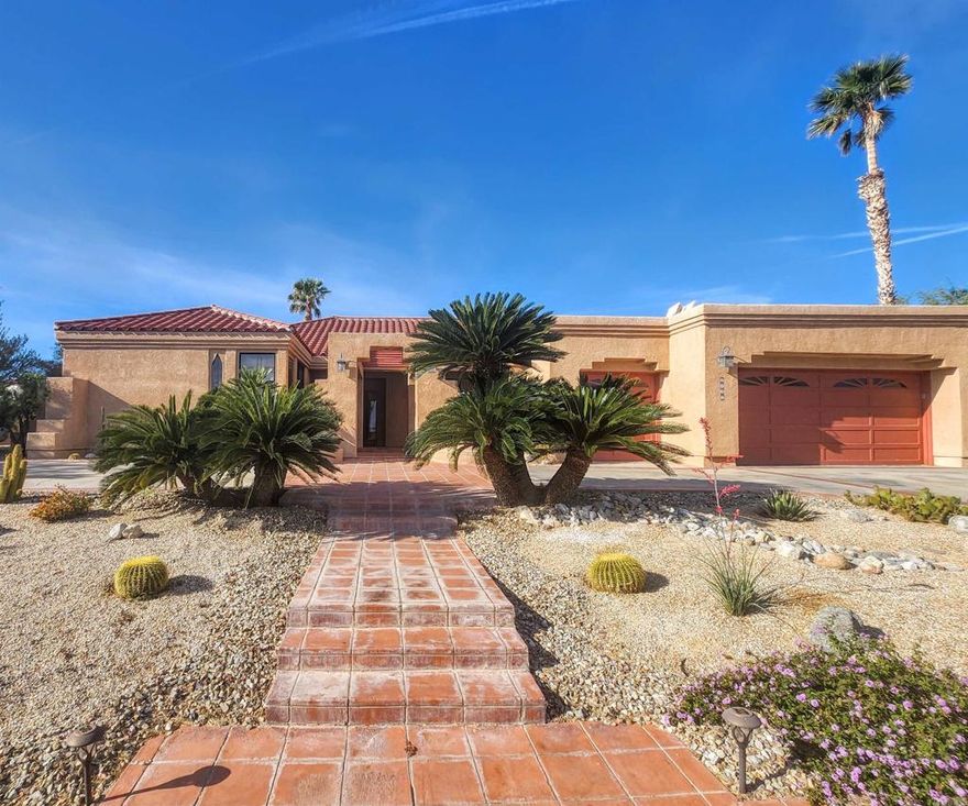 Indulge in desert resort-style living from this fully furnished single-story estate tucked within the exclusive gated golf course community of Rams Hill—set against the sweeping backdrop of the Anza-Borrego Desert. This striking, solar-powered retreat boasts a thoughtfully designed open floor plan with a spacious primary suite, junior suite, and three-car garage (including a golf cart bay)—all currently serving as a successful Airbnb. Step through the entry and admire the soaring tray ceilings, custom tile floors, and two separate living areas, each anchored by its own fireplace and framed by backyard views. The open-concept design blends seamlessly into the expansive chef’s kitchen, where two granite islands, stainless steel appliances, and generous cabinetry invite effortless entertaining and everyday luxury. The oversized primary suite is a private sanctuary featuring its own outdoor patio, a spa-like bathroom with soaking tub, walk-in shower, and dual vanities. The junior suite and additional bedrooms also enjoy patio access, allowing guests and residents to slip easily between indoor comfort and starlit desert nights. Escape to the low-maintenance backyard with multiple patio spaces and a serene desert landscape designed for relaxation or entertaining beneath endless blue skies and dazzling sunsets. Additional amenities include a formal dining area, dedicated laundry room, two Tesla backup batteries, finished garage with skylights, and owned solar for energy efficiency.  Take full advantage of Rams Hill's premier master-planned community amenities including a sparkling pool, tennis and pickleball courts, jacuzzi, and BBQ pavilion—all just moments away. This timeless home blends tranquility, space, and turn-key ease—whether you’re seeking an income-generating vacation rental, a second home, or your everyday escape to the desert.