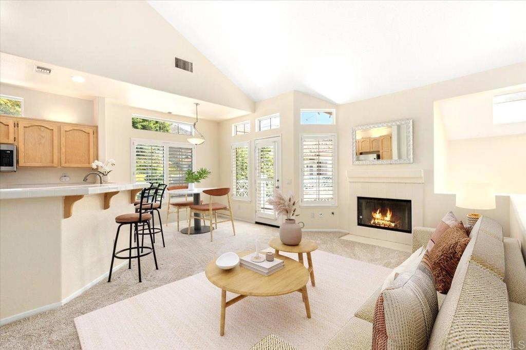 Beautiful two-story condo ideally located in the desirable San Tropico Community of Sabre Springs neighborhood. Corner unit with high ceilings and abundant natural light throughout. Welcoming living area features a cozy fireplace and opens to a private balcony, perfect for enjoying your morning coffee or relaxing with a glass of wine in the evening. Spacious primary bedroom suite is conveniently located on the main level, while the second bedroom upstairs offers flexibility as a guest room or home office. For added convenience, the home includes an in-unit laundry set up, and an attached one-car garage with private driveway and parking pass for an extra vehicle. Plenty of guest parking nearby. Additional highlights include central air conditioning, direct access from the garage and additional storage spaces. This well-maintained community offers a sparkling pool and spa, perfect for relaxation. Conveniently located near major freeways, parks, shopping, casual dining, entertainment and recreational options. The home is located within the highly acclaimed Poway Unified School District. Don’t miss this rare opportunity to own a home in one of Sabre Springs’ most coveted communities. Schedule your private tour today!