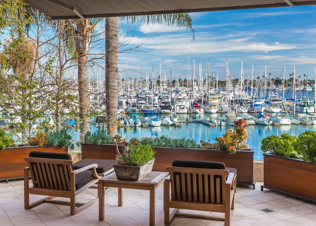 Exquisite bayfront contemporary with rare private dock offers inspired architecture by Ken Ronchetti and flawless interior design. Natural light abounds in this 6,500 SF home with telescoping walls of walnut-framed glass that create a seamless transition. Enter a gated, palm-lined arrival with 4, teak-doored garages and gallery custom door, to a showplace courtyard with multiple entertaining spaces and lap pool. See Supplement. Neighborhoods: La Playa Cove Equipment: Dryer,Fire Sprinklers,Garage Door Opener,Pool/Spa/Equipment, Range/Oven, Washer Other Fees: 0 Sewer: Sewer Connected Topography: LL