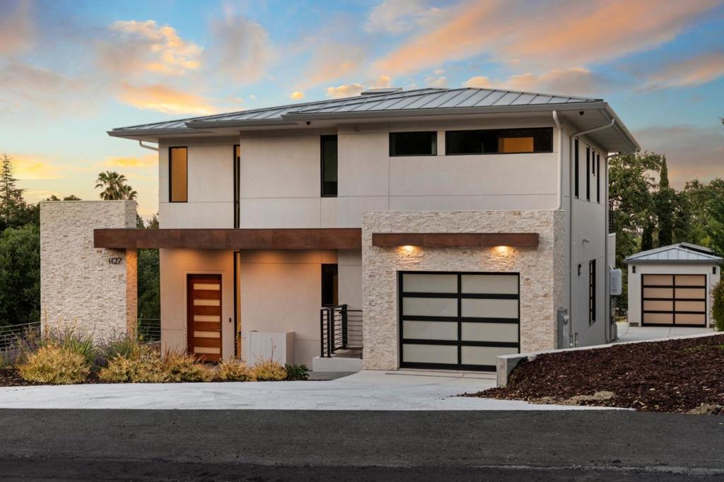 Discover brand new modern luxury in this exquisite contemporary home offering sweeping views of the valley and mountains. Designed with an open-concept layout, the residence features soaring 10-foot ceilings across three levels, including a bright and light filled basement that opens to a spacious patio making it ideal for entertaining or a separate ADU. The interior includes 6 bedrooms, 5 full baths, and 2 half baths, along with a formal living room and a separate dining room. The expansive family room and kitchen combination is a chefs delight, showcasing Italian cabinetry and high-end appliances, including a gas cooktop. Additional amenities include a dedicated entertainment room, private office, home theater, and a wine cellar. Elegant finishes such as hardwood flooring, a durable metal roof, and premium thermally broken aluminum windows add to the home's appeal. Parking is abundant with a 1-car attached garage and a 2-car tandem detached garage. Set on approximately one-third of an acre, the generous backyard is anchored by a mature oak tree and enhanced by breathtaking views, offering a true indoor-outdoor living experience. Easy access to Rancho Shopping Center and Loyola Elementary and just minutes to downtown Los Altos and the prestigious Los Altos Country Club.