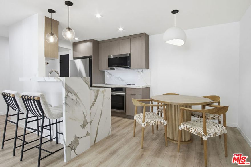 Discover elevated metropolitan living in this impeccably updated 1-bedroom, 1-bath residence, perfectly positioned on one of West Hollywood's most desirable, tree-lined streets. Blending modern sophistication with effortless comfort, this second-floor condo offers a serene retreat just moments from the city's best shopping, dining, and nightlife. Step inside to a light-filled open layout, where a spacious living room with a chic fireplace flows seamlessly to a private, covered balcony overlooking the lush courtyard and sparkling pool, ideal for morning coffee or evening unwinding. Floor-to-ceiling glass sliders invite indoor-outdoor living at its finest. The beautifully renovated kitchen features quartz countertops, sleek cabinetry, and a generous dining area perfect for hosting. The serene bedroom includes an expansive walk-in closet and an east-facing window that welcomes soft, natural light. A spa-inspired bathroom showcases a quartz vanity, floating cabinetry, and a designer shower with a rainfall shower head. Additional highlights include recessed lighting throughout, central AC and heat, and ample storage. Residents enjoy coveted building amenities: a resort-style pool, fitness center, controlled security access, and one assigned parking space in the gated garage. Cable, WiFi, water, trash, and HOA fees are all included, an exceptional value in this premier location. Nestled between Santa Monica Blvd. and Melrose Ave., and just moments from Kings Road Park, Erewhon, Gelson's, and countless iconic L.A. destinations, this unit offers both luxury and lifestyle in equal measure. Available furnished for $3,750 for a truly turnkey, elevated living experience.