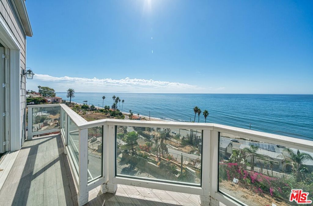 This beautiful move-in-ready home has been cleaned and remediated. You can enjoy panoramic ocean views from almost every room in this over 4,400 SF newer-construction cape-cod property. Even before the fire this house had no direct neighbors on either side, so natural light abounds. The home includes a fully functioning elevator, wood floors, luxury finishes and is fully wired for internet and home entertainment. With garaged parking for 3 cars and quick access to PCH you can easily commute anywhere, or walk over the nearby neighborhood pedestrian-bridge to the beach. This is straightforward sale - not a short sale, foreclosure or probate. Don't miss this opportunity to get a great condition home at 1/2 its pre-fire appraised value.