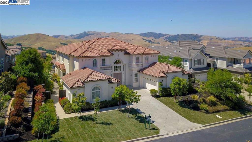 Executive Home in Prestigious Norris Canyon Estates – Fully Furnished. Experience luxury living in this stunning executive rental located in the exclusive, gated community of Norris Canyon Estates. This fully furnished 5-bedroom, 4.5-bath home with solar offers breathtaking panoramic views of the San Ramon Valley and Las Trampas Ridge. Step inside to a grand foyer with a dramatic dual staircase, soaring ceilings, and elegant crown molding. The chef’s kitchen is designed for both function and style, featuring a spacious center island, granite countertops, and premium stainless steel appliances. Enjoy cozy evenings by the home’s two fireplaces and relax in beautifully appointed living spaces throughout. Community amenities include gated security, clubhouse, park & playground, tennis & basketball courts, scenic walking trails. Perfect for corporate relocations or discerning professionals, this home combines comfort, convenience, and upscale living in a quiet, secure setting with easy access to major freeways, top-rated schools, and business hubs.