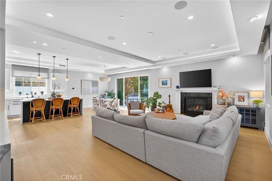 Welcome home to this stunning, detached townhome built in 2022! Upon entering, you'll be greeted with soaring ceilings, tons of natural light, and beautiful hardwood floors. An open floor plan features a spacious living room with fireplace, wet bar with wine fridge, dining area big enough for entertaining, powder room for guests, and a Chef's kitchen with an eye-catching island. Some of the highlights of the kitchen are a Wolf 6-burner gas range and hood, Bosch fridge, and convenient pantry. A private south-facing backyard space is perfect for dining al fresco or hosting a barbecue. Upstairs, you'll find an additional den space great for a reading nook or play space, two balconies, washer and dryer, and all 4 bedrooms. The primary suite features vaulted ceilings, a fireplace, and balcony access. The primary bath is a true spa-like retreat with dual vanities, skylight, large shower, and soaking tub. There is an additional bedroom with en suite bath on this level, as well as a guest bath for the other two bedrooms to share. But that's not all! This home has all the bells and whistles - OWNED solar providing incredible electricity savings, a 5-speaker sound system with music receiver, window treatments with remote control and programming capability, LED lighting, Doorbird front door video system, 5 camera security system, central vac, tankless water heater, automated irrigation system, an epoxy-floored 2 car garage with remotely controlled garage door convenient for deliveries when not at home, pre-wiring for an EV charger, and thoughtful storage spaces and excellent floorplan functionality throughout. A quiet street away from busy roads with a stellar location just one block from Anderson Park and fantastic Lincoln Elementary, 4 minutes from the 405 freeway, and only 2.5 miles from downtown Manhattan Beach. Top rated schools and the irresistible South Bay lifestyle await - what are you waiting for? Come and see this better-than-new-construction home and find the special one for which you've been searching!