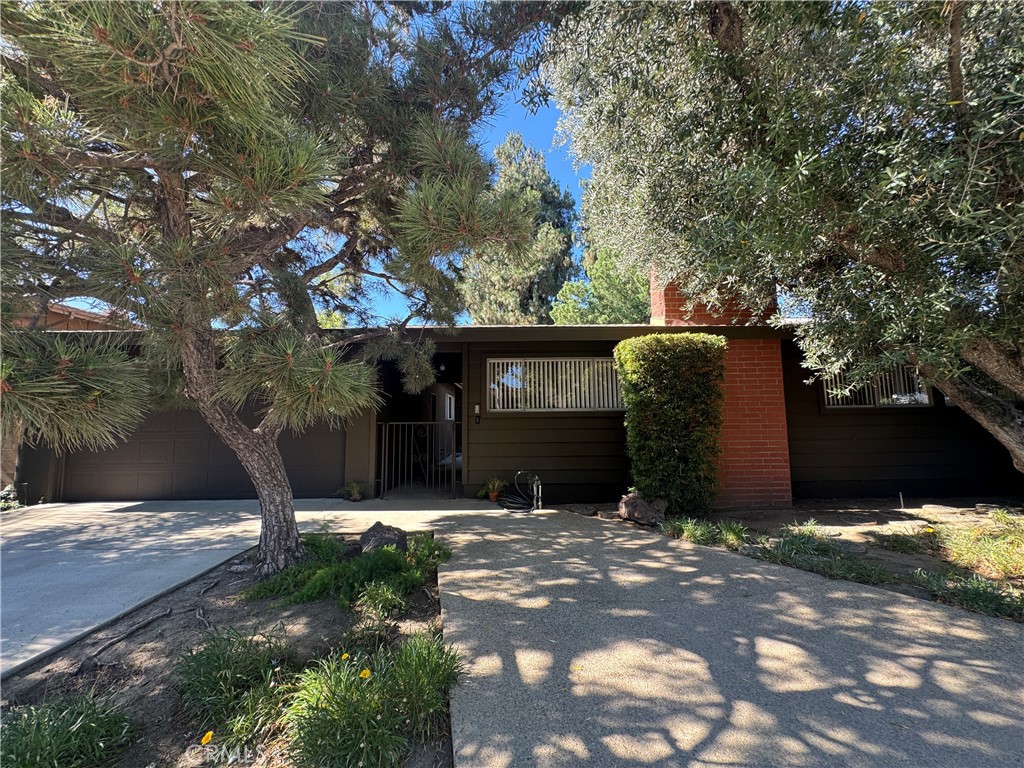 Welcome to this inviting Mid-Century Modern gem, rich with warmth, character, and timeless appeal.
Set on a charming, tree-lined street in desirable North Hills, this single-story, 4-bedroom, 2-bath home offers a comfortable blend of original charm and thoughtful updates.
A welcoming front courtyard leads you into a bright and open layout that flows from the spacious living room with fireplace to the dining area and cheerful kitchen, ideal for both daily living and entertaining. An additional family room offers flexible space for work, play, or relaxation.
The generous bedrooms provide comfort and versatility, while the bathrooms feature a clean, classic style. Outside, the expansive, flat backyard, framed by mature trees is perfect for gatherings, gardening, or simply enjoying the California sunshine.
This is more than a house, it’s a place to call home