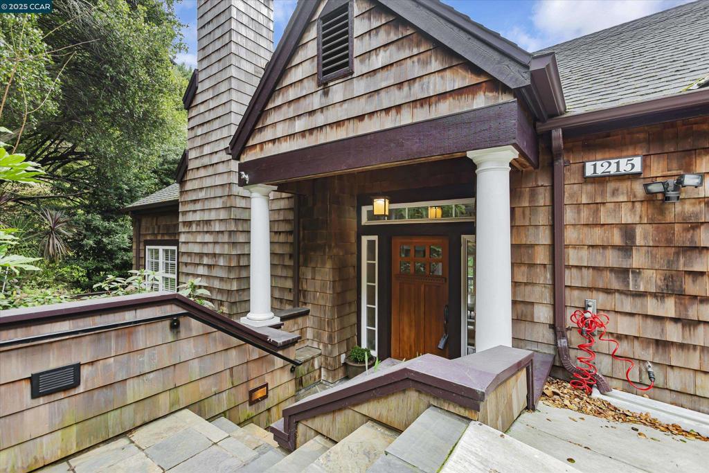 Perched high in the prestigious Berkeley Hills, this 5-bed, 4-bath masterpiece is a striking blend of elegance, strength, & modern luxury. Built in 2001 it rests on a steel-reinforced concrete foundation anchored deep into bedrock. Its double-wall construction enhances fire resistance, insulation, & energy efficiency—delivering not only sophistication, but also lasting peace of mind. Inside, dramatic ceilings & sunlit living spaces showcase Bay views through expansive floor-to-ceiling windows. Designed for both grand entertaining & everyday comfort, the thoughtful layout features a versatile den, a formal dining room, & a chef’s kitchen with custom cabinetry, premium stainless-steel appliances, & an oversized island that naturally draws people together. The lower level reveals a tranquil primary suite, complete with a private balcony, spa-inspired bath, & a generous walk-in closet. Additional highlights include gleaming hardwood floors, a two-car garage with 4 additional parking spaces, & a flexible bonus perfect for a home office, gym, or media retreat. All this, just minutes from Berkeley’s celebrated dining, shopping, & outdoor escapes. Here, hillside serenity meets city convenience—offering a truly rare opportunity to own one of the Bay Area’s most remarkable homes.