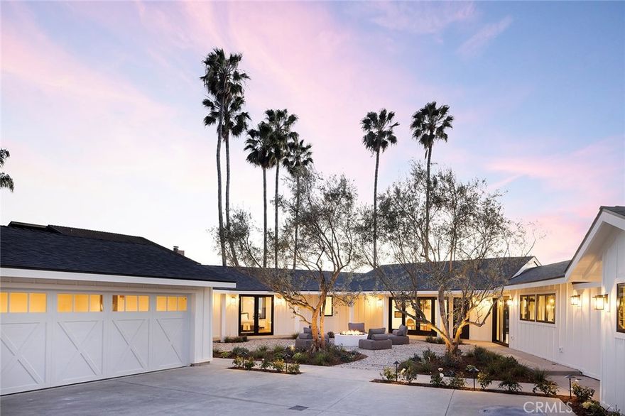 Perched on an approximately quarter-acre lot, this stunning 4-bedroom, 3.5-bathroom San Clemente home has been completely reimagined from the studs up, offering a seamless blend of coastal warmth and modern luxury throughout its approximately 2,978 sq. ft. of living space. Thoughtfully designed by Kaizon Interiors, every element has been curated to create an inviting yet sophisticated retreat. Upon entry, the large open-concept layout unfolds, revealing a spacious living room with a cozy fireplace, a dedicated dining area, and an elegantly designed kitchen, all flowing together effortlessly. Rich wide plank hardwood floors and high-end black accent hardware add warmth and contrast throughout the space. The kitchen is beautifully appointed with all-new Thermador appliances, quartz countertops, a stylish tile backsplash, pendant lighting, and a breakfast counter, balancing both form and function. The primary suite is a true sanctuary, featuring an ensuite bath with dual sinks, quartz countertops, a walk-in shower, and a freestanding soaking tub, as well as a custom-built dual closets for elevated organization. Three additional bedrooms provide flexibility, including one with a private entrance and ensuite bathroom, making it ideal for multi-generational living, an ADU, or a guest suite. Designed to embrace the indoor-outdoor lifestyle, the home’s horseshoe-shaped layout wraps around a central courtyard, creating a private and tranquil open-air retreat. Multiple access points seamlessly connect the home to this lushly landscaped space, where a cozy firepit provides the perfect gathering spot for relaxing under the stars. Beyond the courtyard, the backyard opens to stunning ocean views, offering a breathtaking backdrop to this exceptional coastal home. Positioned below street level for enhanced privacy, this home offers a rare combination of seclusion, architectural innovation, and luxury coastal living in the heart of San Clemente.