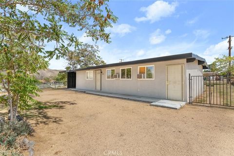 Photo of 7427 Acoma Trail, Yucca Valley, CA 92284 (MLS # IG25228333)