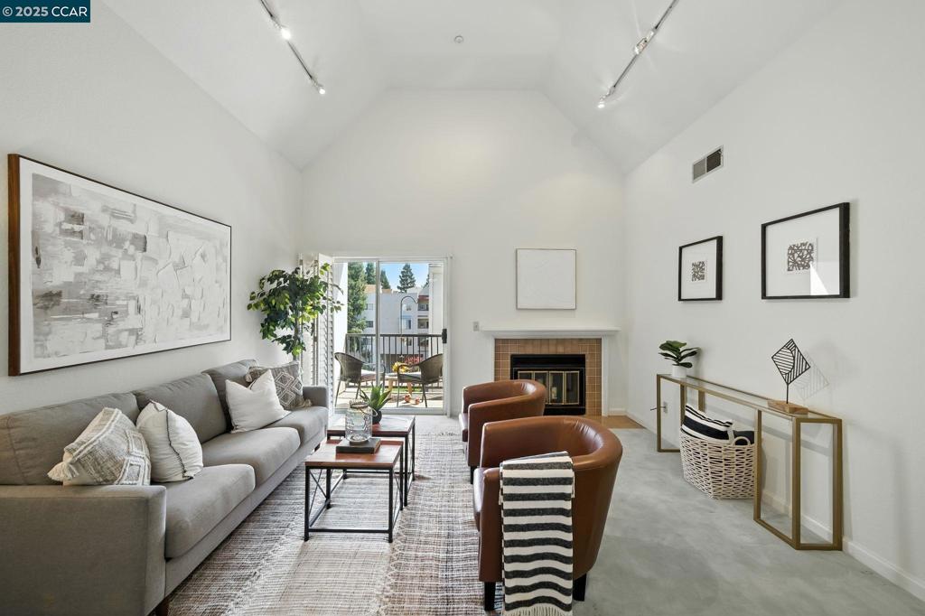 Charming Top-Floor End Unit in the Heart of Walnut Creek Welcome to this beautifully updated top-floor end unit, ideally situated in one of Walnut Creek’s most sought-after gated communities. Brimming with charm and natural light, this condo offers a spacious living room featuring vaulted ceilings and a cozy fireplace—perfect for relaxing or entertaining. Step out onto your private, covered balcony to enjoy your morning coffee or unwind after a long day. Inside, you'll find an in-unit washer and dryer for your convenience, as well as an updated kitchen and bathroom, complete with modern finishes. Plantation shutters throughout add a touch of elegance and privacy. The unit includes one dedicated parking space in a secure gated garage, plus access to a wide range of community amenities including a sparkling pool, hot tub, indoor gym, BBQ area, elevator access, and plenty of common areas perfect for relaxing or socializing. Enjoy a premium location just a short stroll to BART, coffee shops, and restaurants. The scenic Iron Horse Trail is right across the street for walking or biking, and downtown Walnut Creek—with its vibrant shopping, dining, and cultural attractions—is just minutes away. Quick access to major freeways makes commuting a breeze.