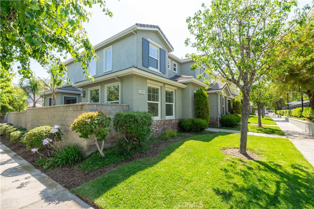 Perfection in Porter Ranch! Welcome to this upgraded Plan 2 Arbor, located in the guard-gated & prestigious community of Promenade. Situated in a prime location, only a few steps to the sparkling & inviting community pool & spa. Upon entering this gorgeous masterpiece, you are greeted by custom floors. The cook's kitchen proudly boasts a breakfast bar, breakfast nook, plenty of cabinet/storage/pantry space & more. Grand living room, featuring a built-in media niche & dual-sided fireplace. The dining area is perfect for entertaining, Holiday gatherings and family meals & is highlighted by a built in cabinet. Travel upstairs to find 3 large bedrooms, including an impressive master suite. The master suite features a huge walk-in closet. Also located upstairs is a convenient, built-in desk, which is perfect for a home office or homework station. 2 car attached garage with direct access. This townhome is attached to only one other unit, making it an end unit. Promenade offers a sparkling & inviting community pool & spa, plenty of park benches for picnics. Promenade is also located in the highly sought after Porter Ranch Community School K-8 district (Per LAUSD website. Buyer to independently verify the district & enrollment). Conveniently located near the amazing Vineyards shopping center, where you can enjoy fine dining, a state of the art AMC movie theater, Whole Foods with a restaurant & so much more. If you are looking for the best of Porter Ranch, your search is over.