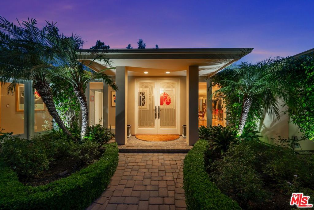 Located on a quiet cul-de-sac, and set behind gates, this charming and well maintained single-story contemporary boasts dramatic city views, while sitting on an expansive, almost acre curated piece of land. Walk through an inviting exterior courtyard, and into a home that is exceptionally bright and airy featuring floor to ceiling windows/doors, and a thoughtful floor plan with great functionality and flow. Wood flooring throughout connects two spacious bedrooms + an office on one side of the home, and an additional guest suite on the other. Sophisticated design with warm elegance, this home was built to entertain. The landscaped backyard has multiple curated areas in which to entertain, including pool, outdoor bbq, sitting area with fire pit, koi pond, and more. This turn-key home checks all of the boxes: private and gated, on a large almost acre property with city views.