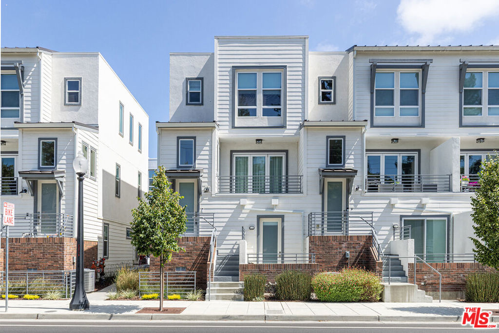 Welcome to this modern, tri-level townhouse located in the heart of downtown Napa! An abundance of natural light permeates throughout this contemporary residence. The first level features a bedroom and full bath with private outdoor deck access, ideal for hosting guests or working from your home office. The spacious two-car garage includes direct access. The second level features an open-concept design that seamlessly blends the upgraded chef's kitchen, dining area, and living space with stackable glass doors that open to a deck ideal for family gatherings and entertaining. A laundry area is also thoughtfully located on this floor, providing ultimate convenience, along with a powder room. Upstairs on the third floor, discover a generously sized master bedroom with a charming view window, a walk-in closet, dual vanities, and a luxurious shower. The additional second bedroom features an attached bathroom with a shower/ bathtub. All bedrooms are ensuite, with hardwood floors throughout. Don't miss your chance to live in one of Napa's most desirable new communities where style and convenience come together in a great location where you can walk to all the restaurants, parks, theaters, etc. Perfect for second home buyers!