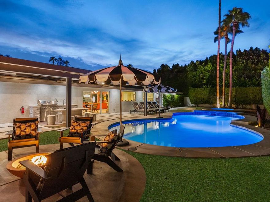 Bold design elements and thoughtful updates define this vibrant Palm Springs retreat where sophistication meets comfort. Behind a new privacy wall and motorized gate, the residence reveals multiple entertaining areas, abundant natural light, and an effortless indoor-outdoor connection that also captures beautiful mountain views. The open layout links the living room to an expansive kitchen with quartz surfaces, a massive island, and stainless-steel appliances--an inviting space for cooking, dining, and gathering. Modern improvements include new HVAC systems, paid solar system with additional battery storage, an EV charger, and upgraded pool equipment with heater for energy-efficient living. The resort-style backyard has been redesigned with an added spa, a relocated fire pit, a barbecue station, and a huge wide pergola covering the patio with integrated lighting for relaxing or hosting gatherings. Three well-sized bedrooms, including a serene primary suite with stylish touches, provide privacy and comfort. Additional upgrades such as newer patio doors in the dining area, newer patio doors in all three bedrooms, epoxy-finished garage flooring, upgraded exterior lighting, and professionally designed desert landscaping enhance the home's aesthetic, comfort, and long-term value. Furnishings are negotiable outside escrow per the Seller Inventory List. The residence has a very successful STR track record.